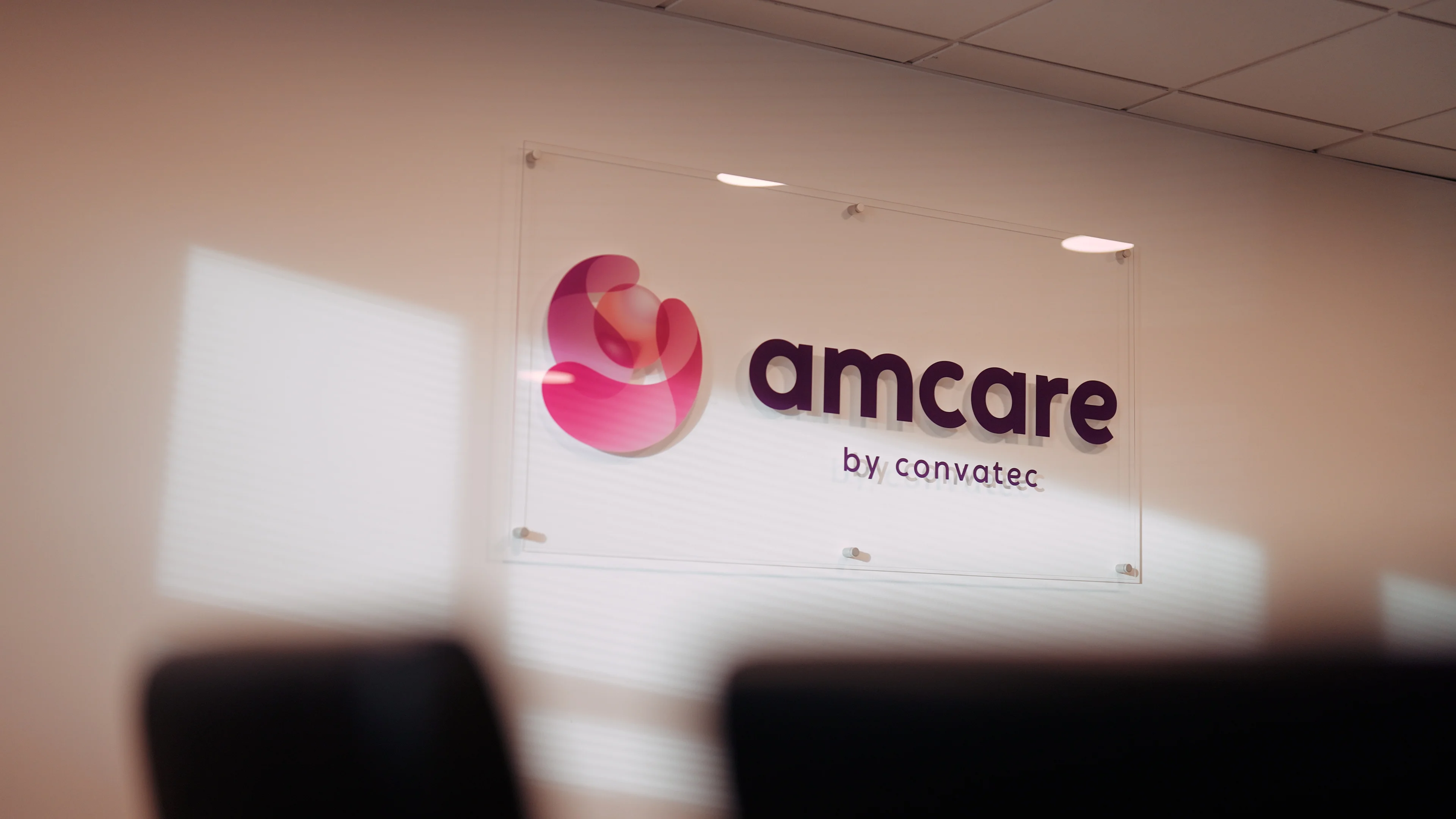 A woman smiling at another woman