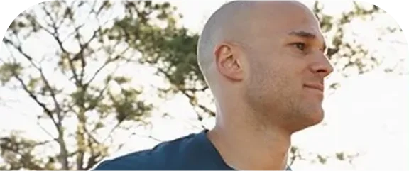 a man wearing a white hat