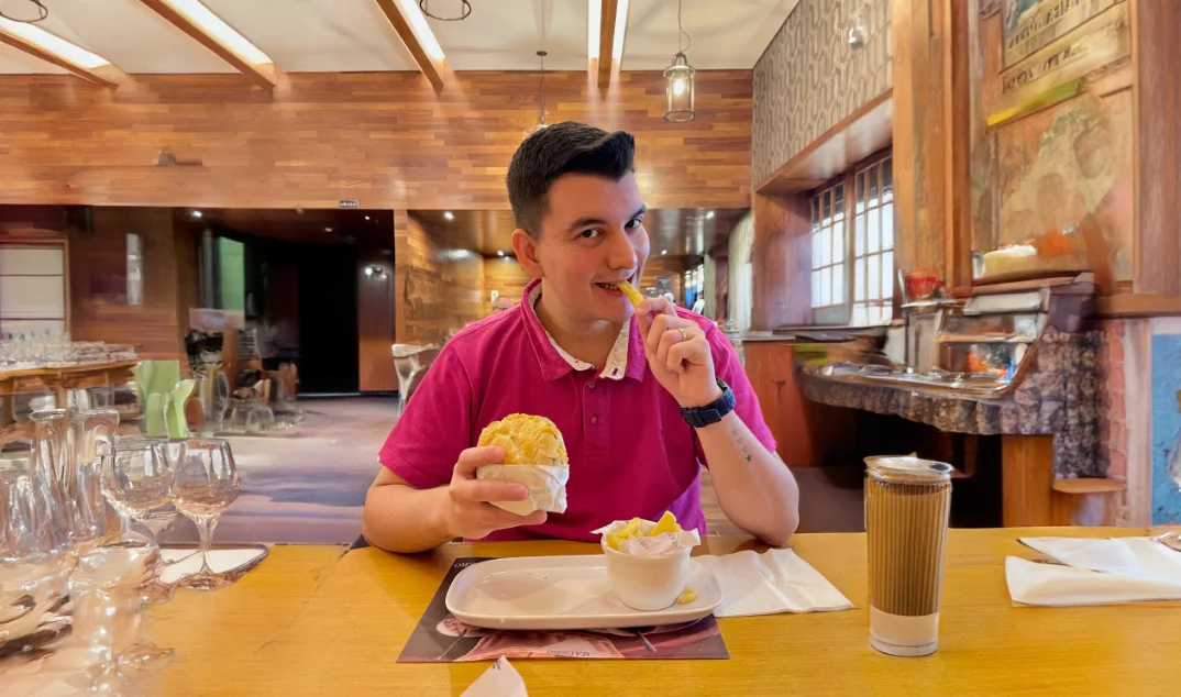 a person eating a hot dog