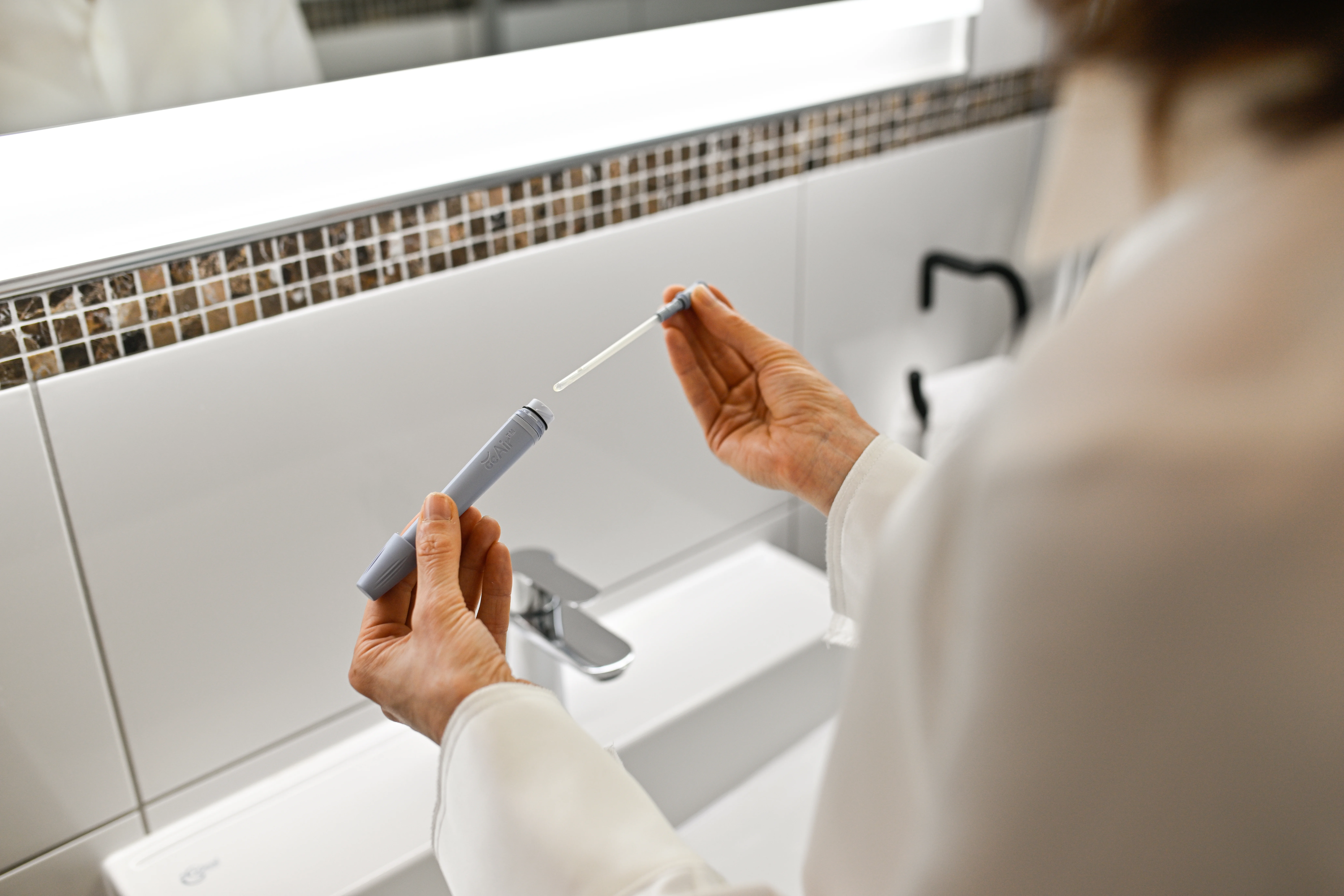a person holding a syringe