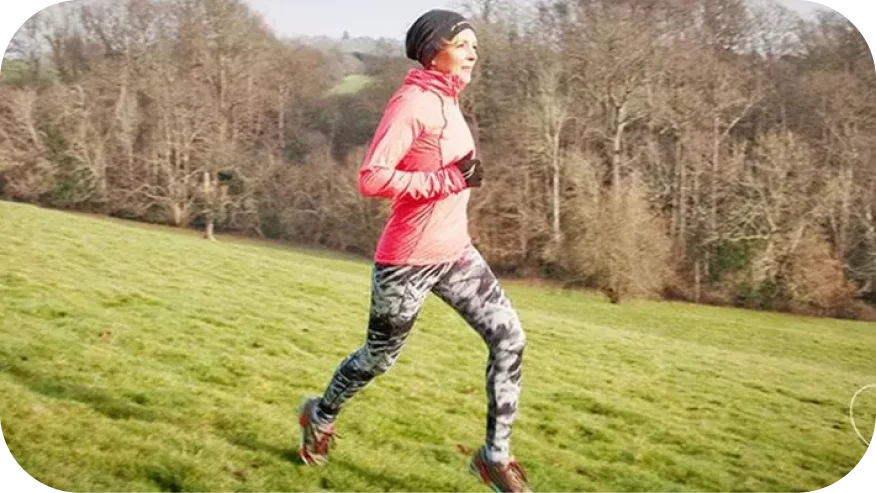 a man running on a grass field