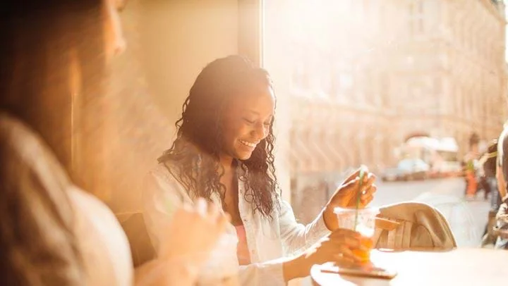 a woman smiling at a man