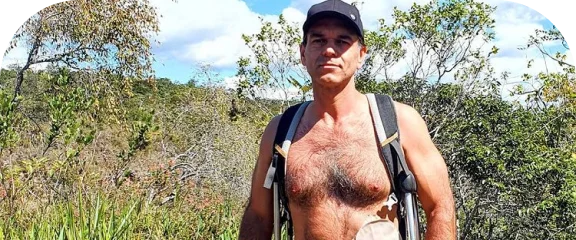 a man with a hat and backpack