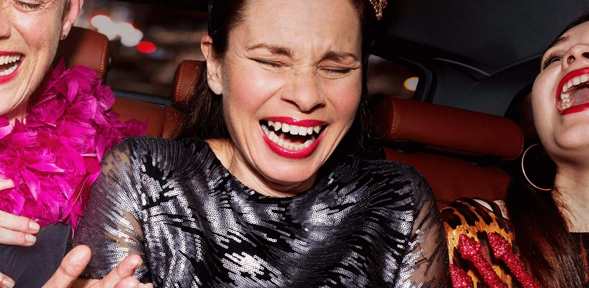 a person laughing with the mouth open