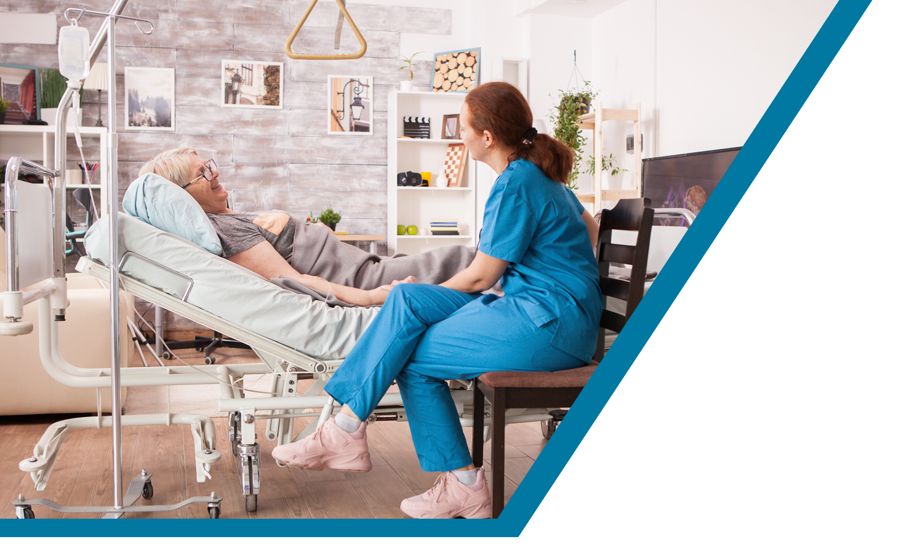 a woman sitting on a chair next to a man in a hospital bed